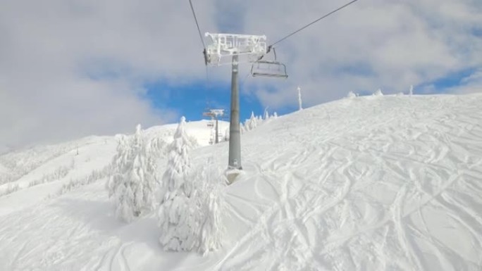 POV: 在斯洛文尼亚的一个滑雪胜地的履带式斜坡上乘坐滑雪缆车。