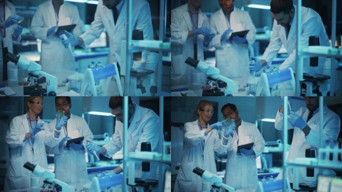 医学研究科学家团队在试管和平板电脑中病毒样品的帮助下开会并进行实验。应用科学实验室，拥有不同的多种族