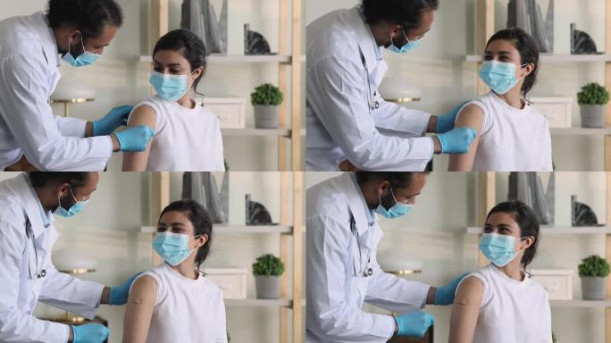 接种covid疫苗后，医生将石膏涂在患者的肩膀上