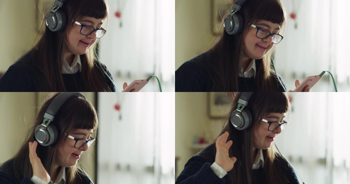 电影拍摄的唐氏综合症快乐微笑的少女，喜欢用耳机听她最喜欢的音乐播放列表，在家跳舞。概念: 技术、残疾