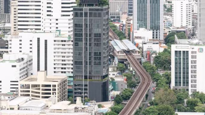 4K UHD缩小延时: 泰国曼谷的曼谷市中心摩天大楼天际线与汽车和天空列车。现代城市景观和交通概念。