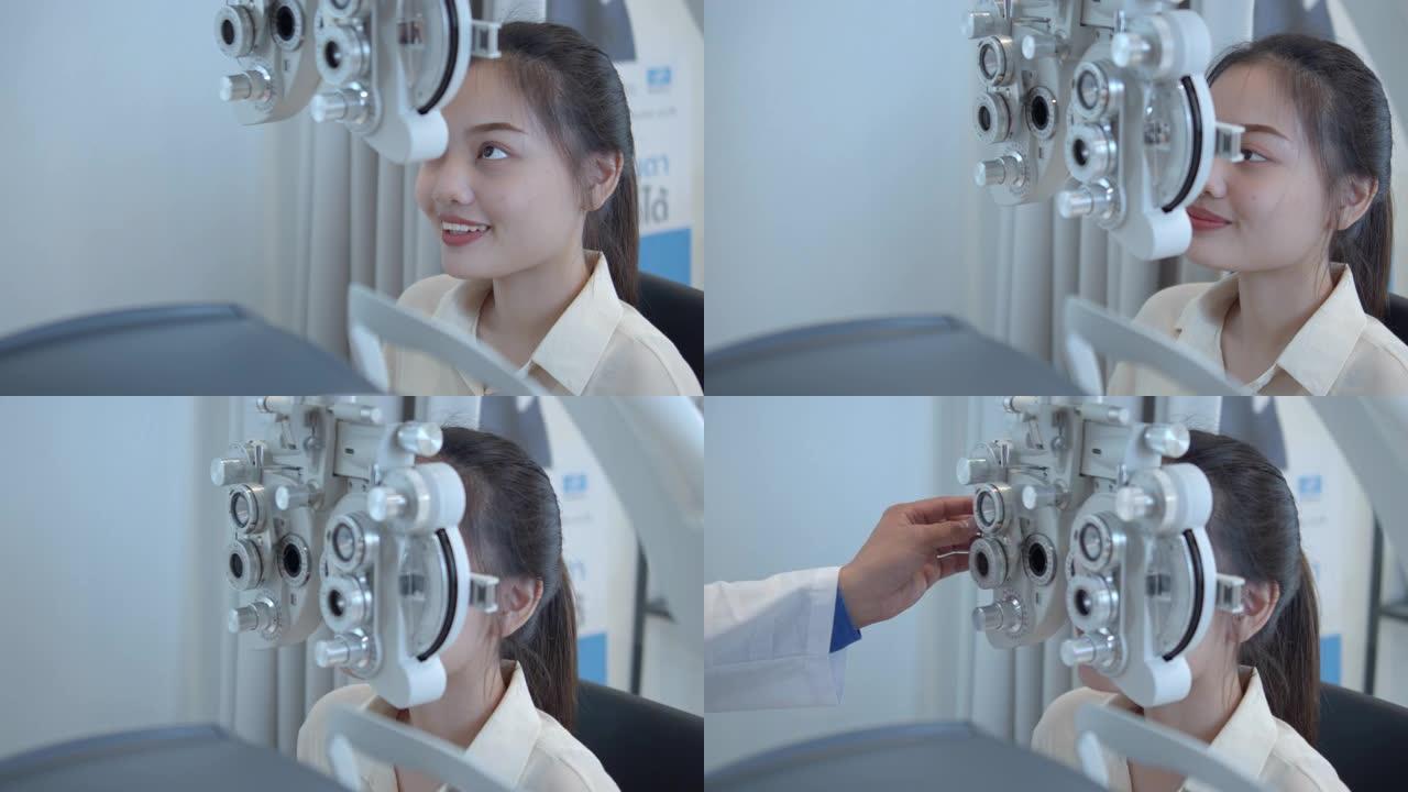 男性验光师用机器检查女性患者的视力