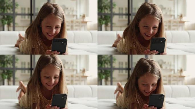 开朗真诚的小女孩喜欢在家使用手机。
