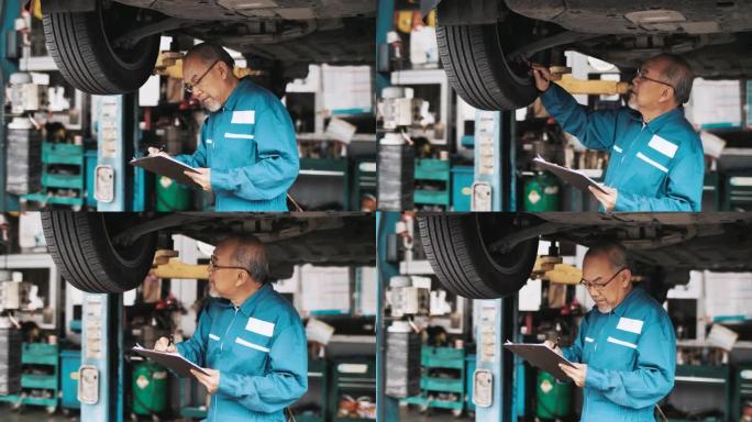 高级机械师在汽车服务中检查在车辆上工作的汽车悬架