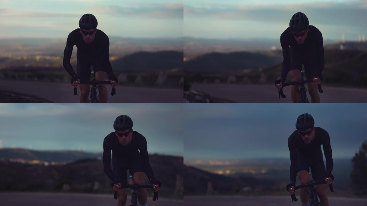 专业自行车手在日出时骑在山顶上骑自行车