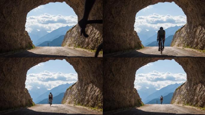 Fit公路自行车手骑在山口上，穿过岩石隧道