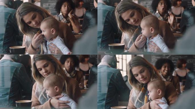 年轻的母亲在咖啡馆里照顾婴儿，使用奶嘴养育孩子在繁忙的餐厅里放松，享受母亲的生活