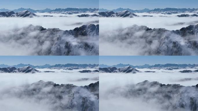 四川金山的雪山山脉令人惊叹的空中冬季景观，蓝天下有云雾