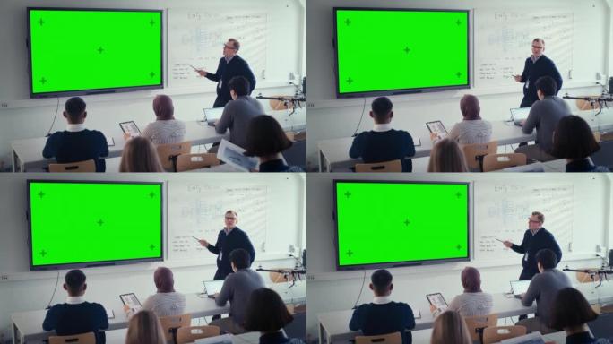 男老师使用水平绿色模拟绿屏交互式数字白板向不同的学生群体解释课程。科教理念