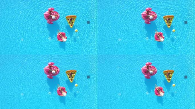 空中: 在泳池派对上，在一群朋友的上方飞行，在漂浮物上放松