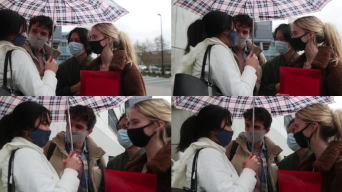 共享雨伞的学生友情下雨天一把伞