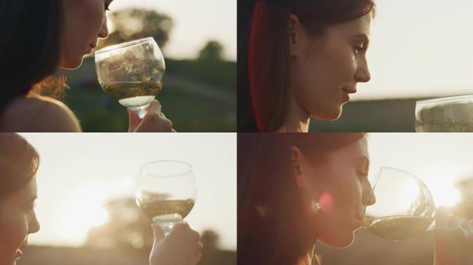 在日落时分，风景秀丽的葡萄园背景上品尝着一种味道，喝着倒入透明玻璃杯中的白葡萄酒。