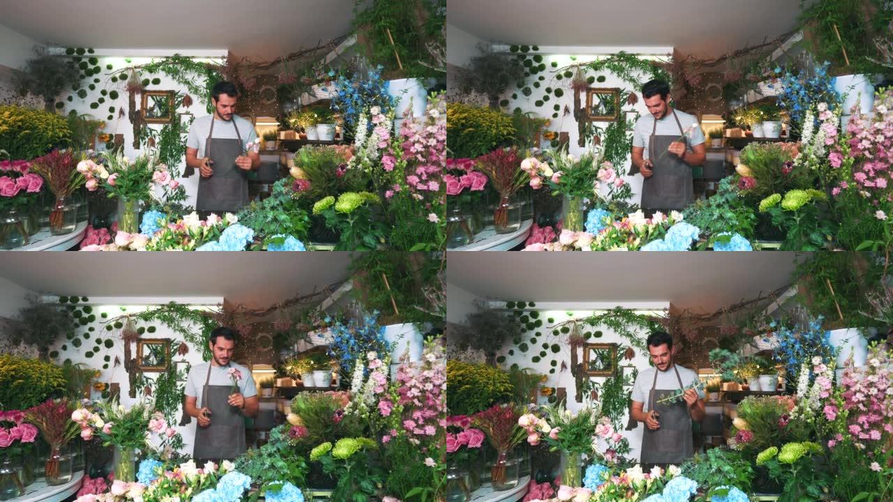 Male florist working in the flower shop.
