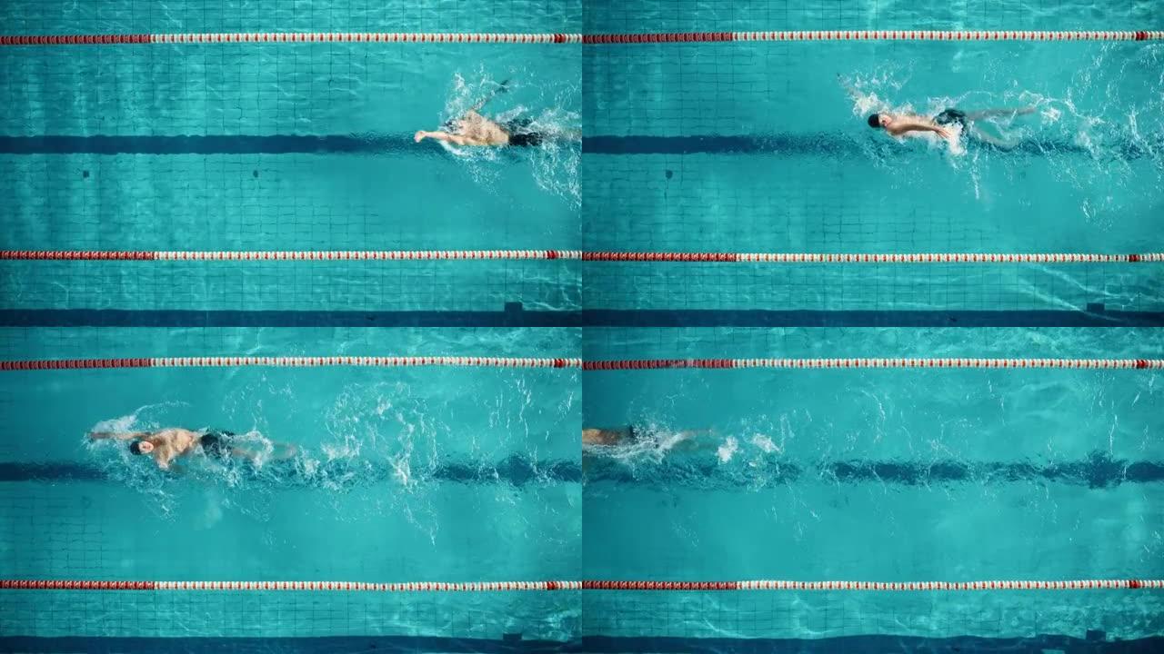 空中俯视图: 游泳池中肌肉发达的男性游泳者。专业运动员以仰泳的方式游泳，在训练中决心赢得冠军。电影慢