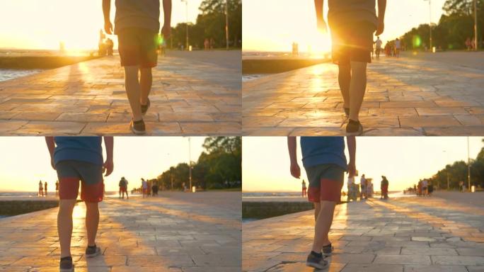 低角度: 穿着短裤和运动鞋的男性游客沿着扎达尔长廊散步。