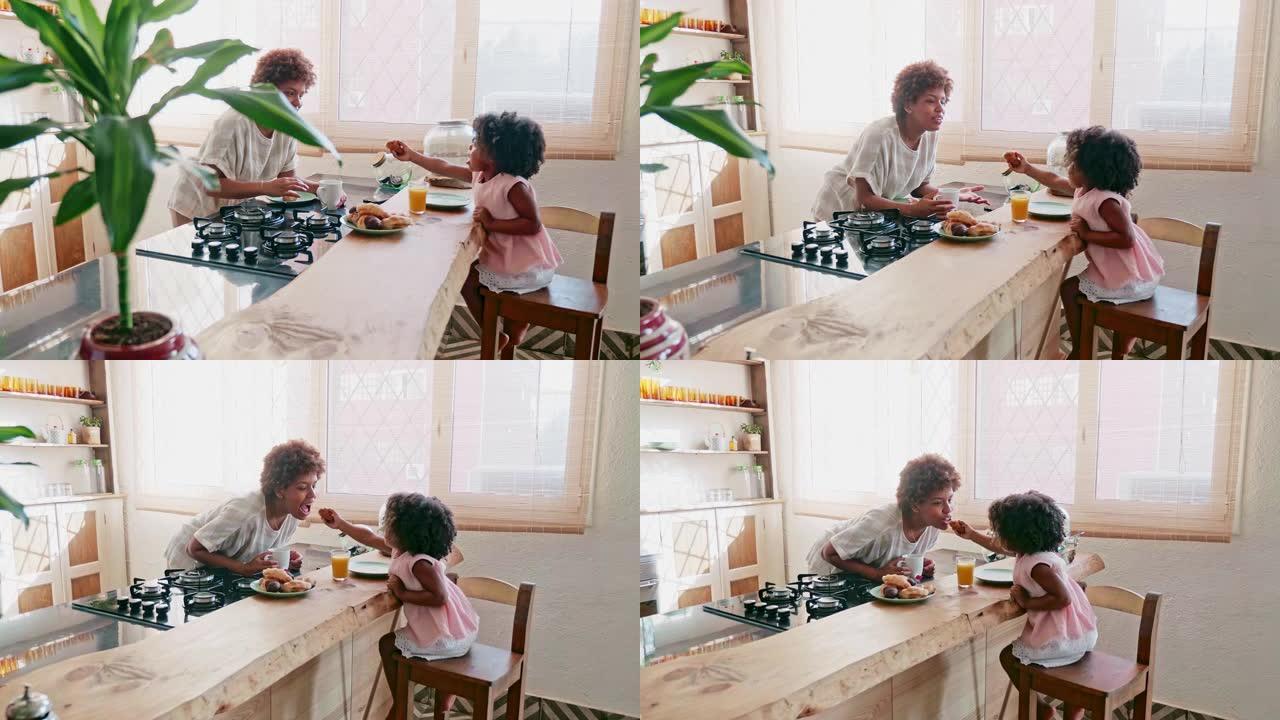 非洲加勒比母女享受早餐的慢动作视频