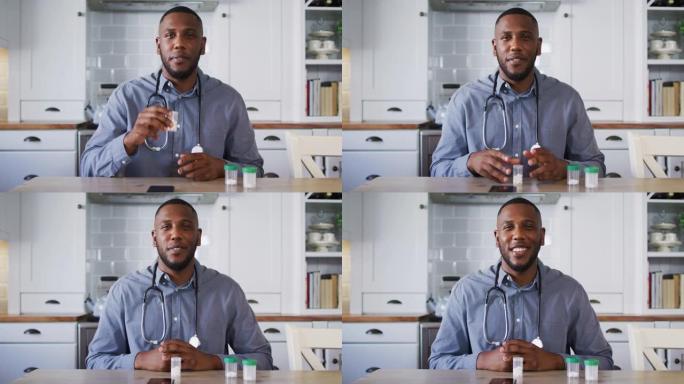 非裔美国医生拿着药物容器的肖像在视频通话时说话