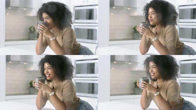 4k视频片段，一名年轻女子在家下雨天在厨房放松咖啡休息