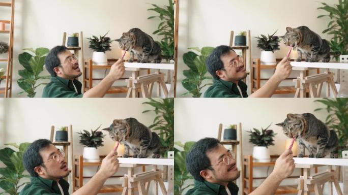 亚洲家伙和我最喜欢的猫打开会员框。