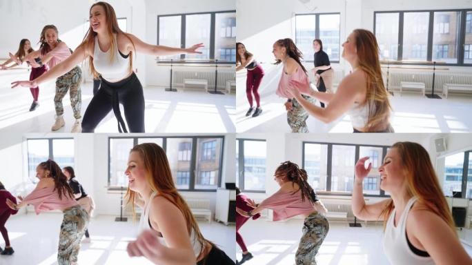 女人在健身课上对人们进行尊巴舞锻炼