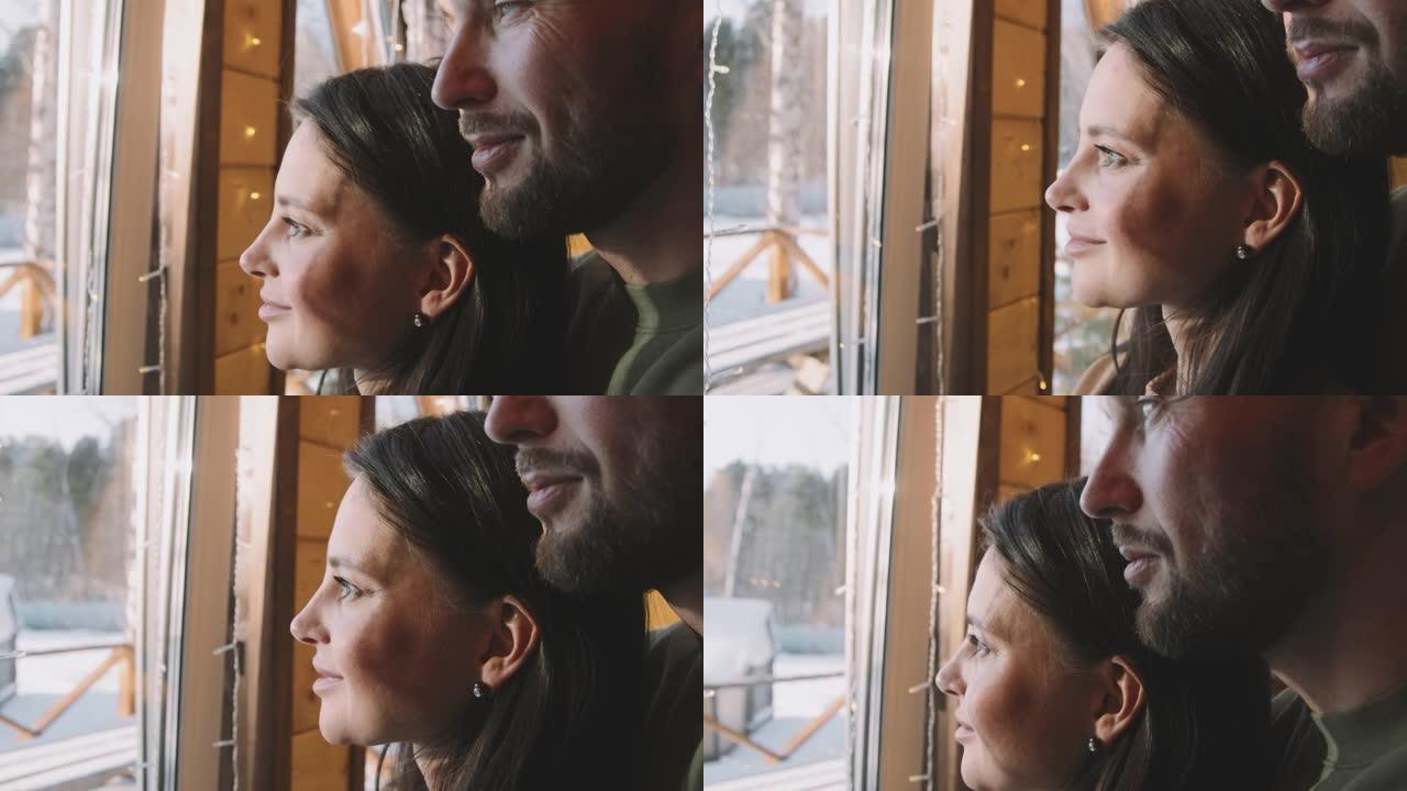 夫妇从窗户欣赏风景
