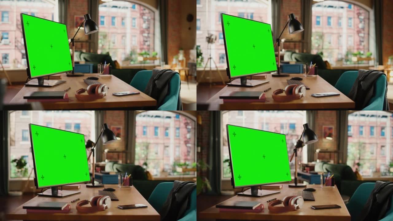 台式电脑，模拟绿屏显示站在舒适的客厅的桌子上。在背景中，时尚的现代明亮的家庭办公室工作室白天有大的城
