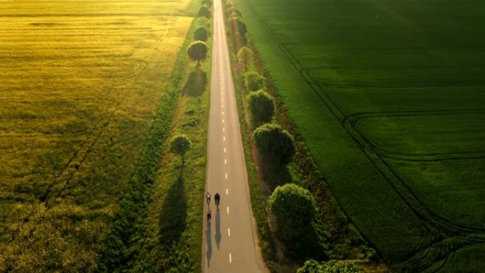 空中骑自行车的人在乡村道路上骑自行车