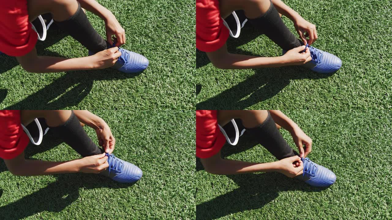 非裔美国足球小子系鞋带