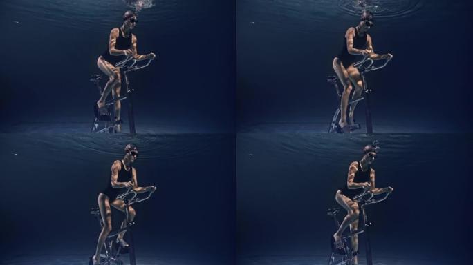 年轻女性运动员身体健康的电影镜头正在水下固定自行车机上努力和决心地锻炼。运动、健身、健康生活方式、娱