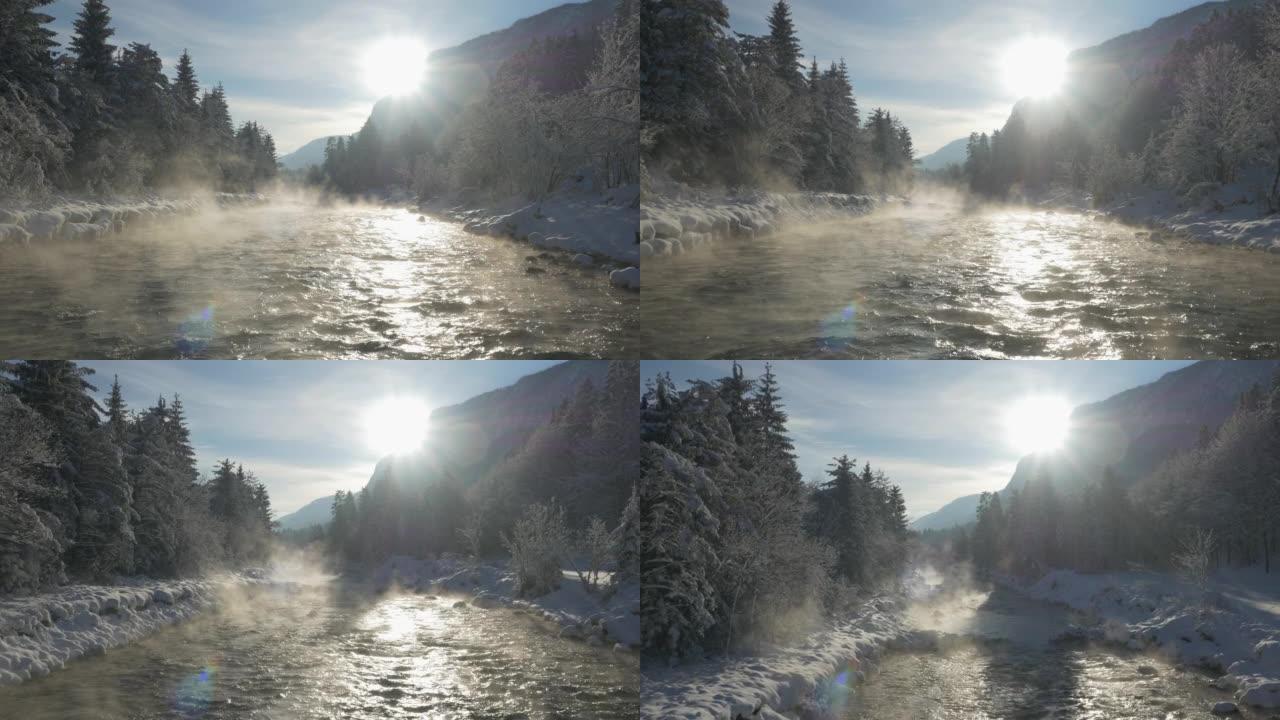 空中: 在一个寒冷的下雪的早晨，晨雾在流动的萨瓦河上方升起