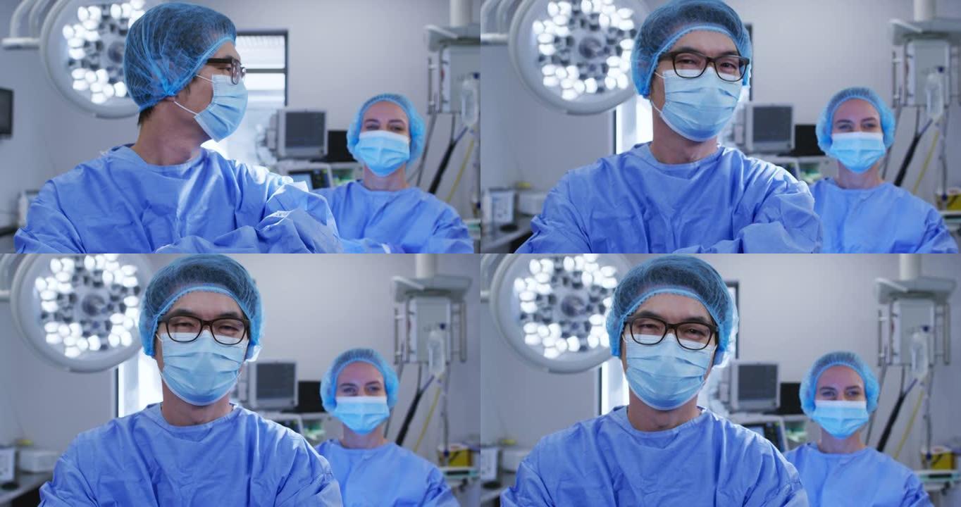 医院里有口罩和防护服的多种男性和女性高加索外科医生
