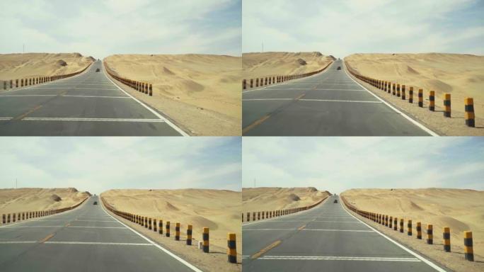 汽车在高速公路上穿越沙漠