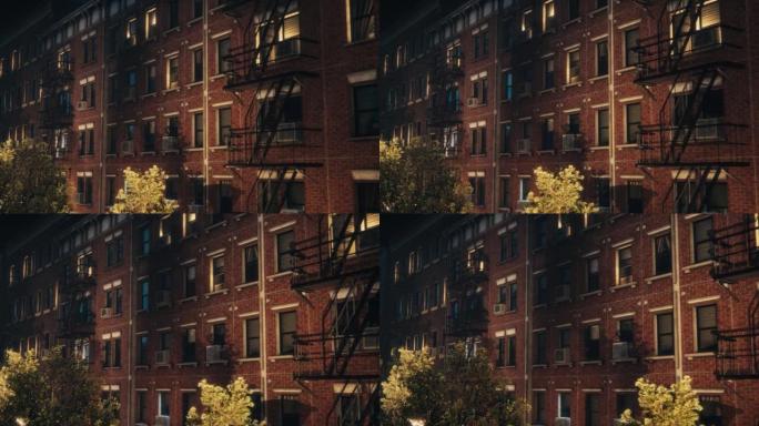 建立镜头: 3D VFX动画砖多层公寓楼。二十世纪褐砂石屋。带有紧急楼梯和路灯的房屋夜间的城市景观。