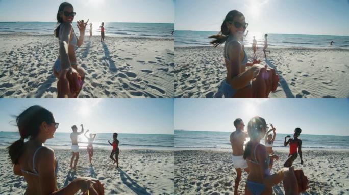 穿着泳衣的年轻多种族无忧无虑的朋友的慢动作在阳光明媚的日子里，在海边的海滩上玩得很开心，一起享受暑假