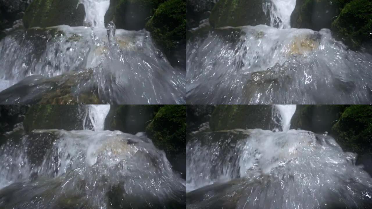 河上沸腾的山瀑布。从水位拍摄，慢动作