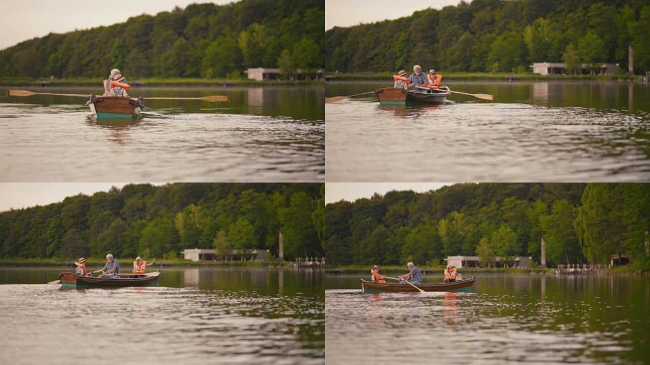 祖父和孙子在湖上划船