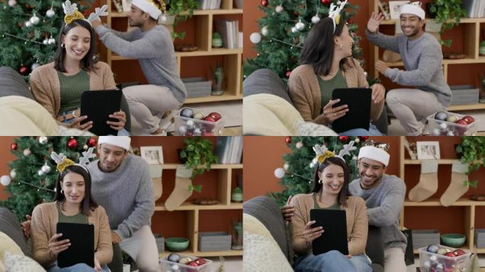 一对年轻夫妇在家里装饰树时使用数字平板电脑进行视频通话的4k视频录像