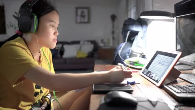 昏昏欲睡的少女在家用数字平板电脑在线学习