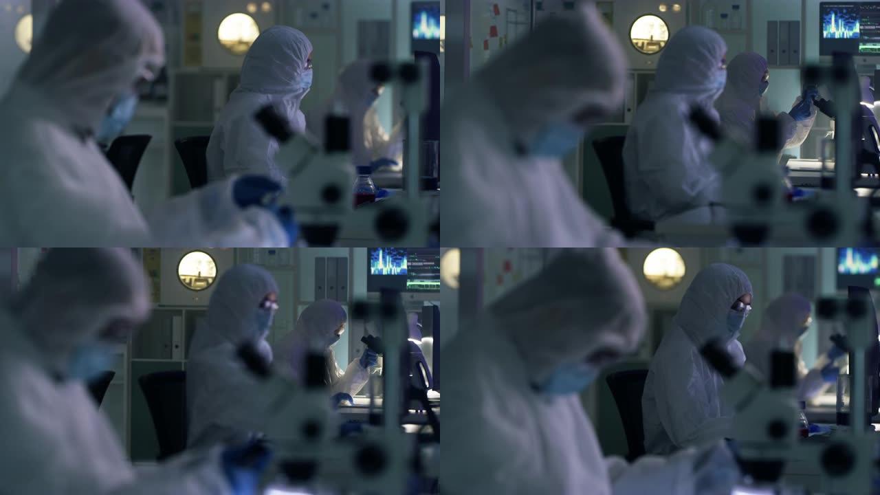 科学家在实验室工作时穿着辐射服的4k录像