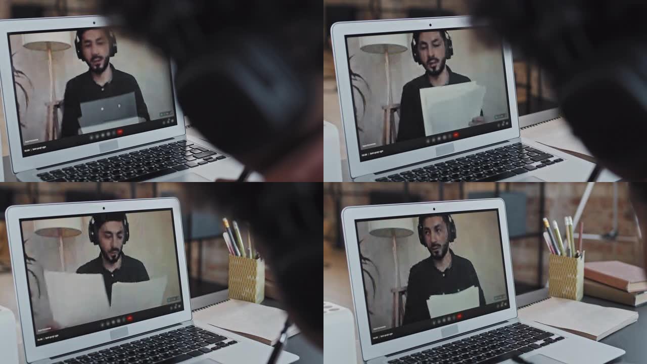 男子在笔记本电脑屏幕上教授在线课程