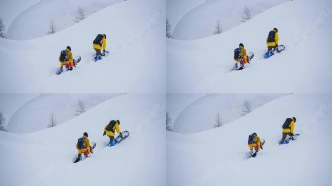 滑雪者在山上的深雪中攀登