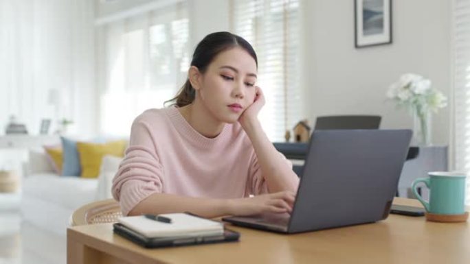 迷人美丽的年轻亚洲女性感到疲惫过度劳累负面影响健康生活伸展休息时间放松压力缓解概念问题在家远程工作或