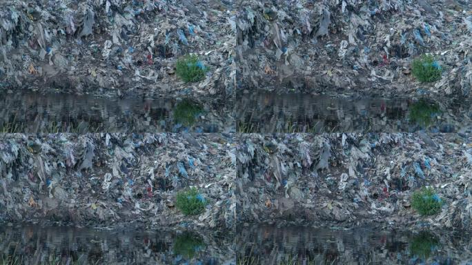 大型废物和垃圾场到处都是鸟类和寄生虫。消费与环境污染的概念现代社会。家庭和化学商品对自然的污染。拯救