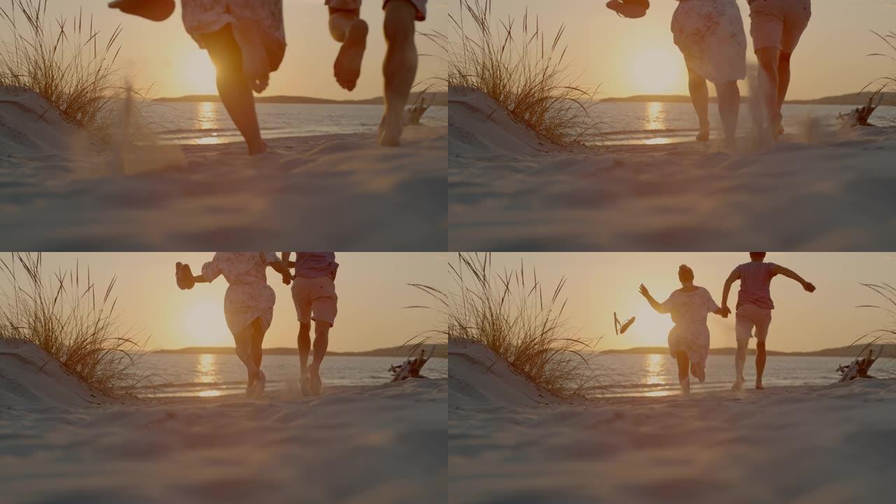 撒丁岛海滩上奔跑的一对夫妇的超级SLO MO视图。