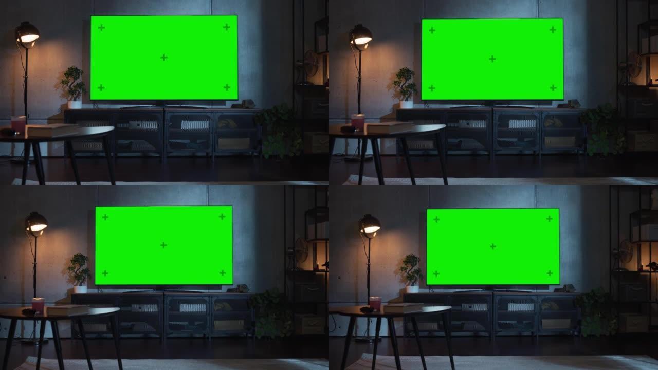 用水平绿屏模型缩小电视镜头。家里的晚上客厅，显示器上有色度键占位符。没有人