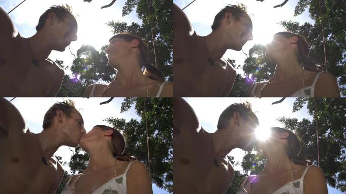 慢动作: 年轻男女在阳光下接吻