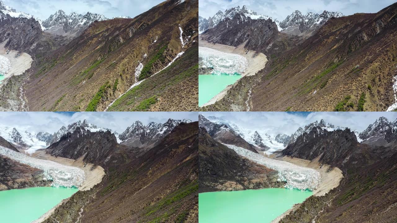 冰川从山顶涌入绿色的高山湖泊