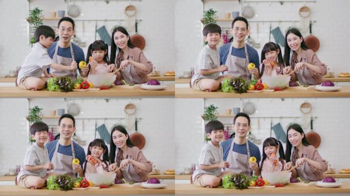 健康家庭的肖像，通过学习烹饪素食享受休闲时光。