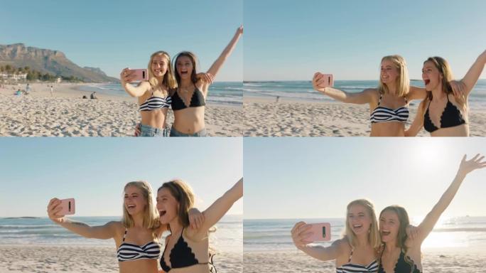 最好的朋友在海滩上自拍，使用智能手机少女分享暑假，享受海边的夏日时光