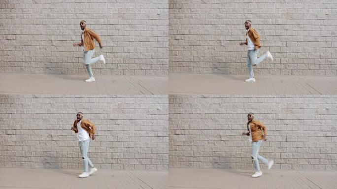 喜出望外的非洲裔美国人在砖墙背景上奔跑和尖叫的循环肖像